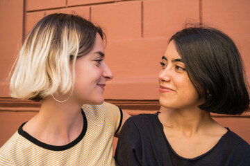 Loving lesbian couple at the street.