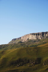 stone and grassy landscape. mountains