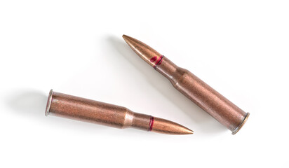 Fototapeta premium Two copper machine gun bullets isolated on white background