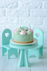 Cheesecake without baking with matcha tea on a table
