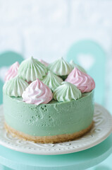 Cheesecake without baking with matcha tea on a table