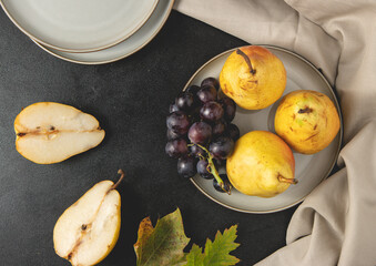 Fresh organic autumn fruit. Grapes and pears. Top view, flat lay.