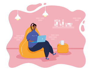 afro ethnic woman using laptop in livingroom