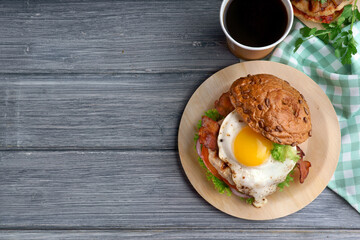 Delicious fresh Burger with egg and coffee in the morning