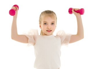 Little girl doing exercises with dumbbells.