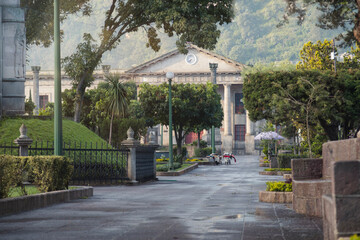 Central park of Quetzaltenango Guatemala early in the morning - empty park of colonial city with...