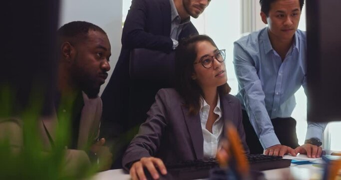 Business people working looking at computer screen in office