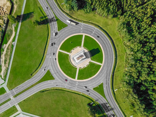 Aerial view of the ring road with a three-way fork on a Sunny summer day. City infrastructure. Beautiful top view of the ring road. Different path direction