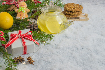 Tea with lemon. Christmas card. Prevention of colds. Christmas background. A festive composition. New year