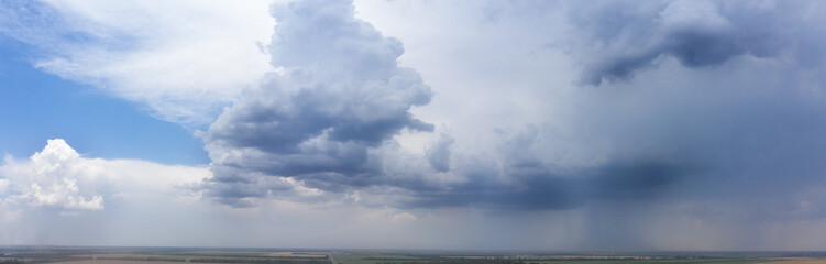 White clouds on a background of blue sky. Panorama