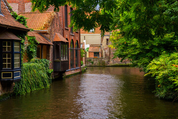 Fototapeta na wymiar Bruges, Flanders, Belgium, Europe - October 1, 2019. Medieval ancient houses made of old bricks and water canals in Bruges (Brugge) West Flanders province, Belgium.