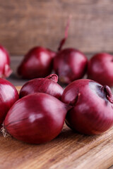 red onions on rustic wood