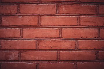 Obraz premium old brick wall of dark scarlet color. close-up