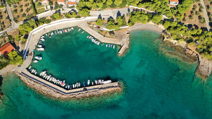 Aerial drone photo of beautiful seaside village and turquoise beach of Porto Germeno, Corinthian gulf, West Attica, Greece