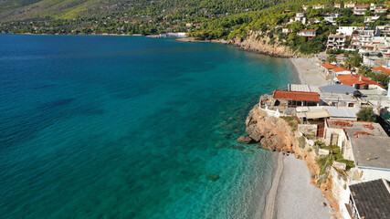 Aerial drone photo of beautiful seaside village and turquoise beach of Porto Germeno, Corinthian...