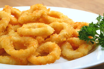 Crispy Calamari Rings on a White Plate