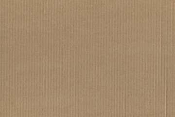 Fototapeta na wymiar Close up of a light brown vintage rough sheet of carton. Cardboard paper texture with a blank background. Empty papercraft surface. Recycled environmentally friendly material.