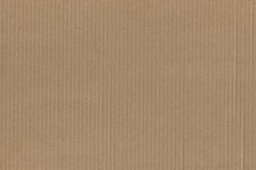 Close up of a light brown vintage rough sheet of carton. Cardboard paper texture with a blank background. Empty papercraft surface. Recycled environmentally friendly material.