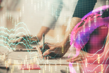 Multi exposure of woman hands typing on computer and financial chart hologram drawing. Stock market analysis concept.