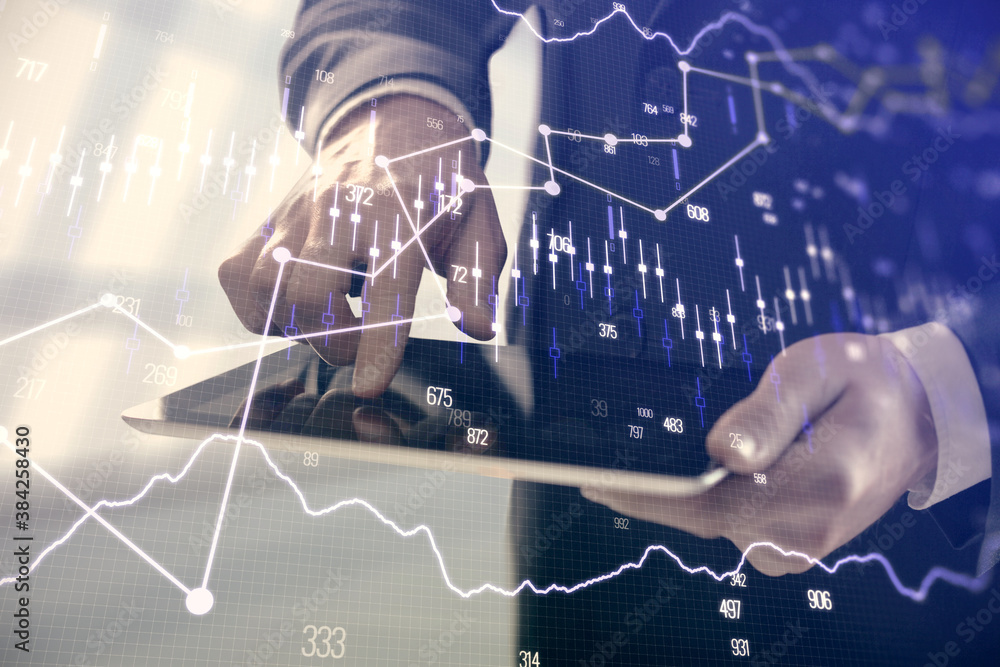 Poster double exposure of man's hands holding and using a digital device and forex graph drawing. financial