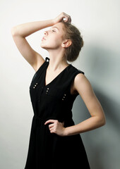 Fototapeta premium young fashion blond woman in black dress