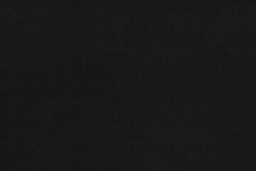 A black vintage rough sheet of carton. Recycled environmentally friendly cardboard paper texture. Simple gray minimalist papercraft background.