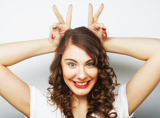 Funny woman doing hand sign