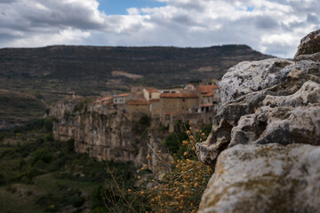 Landscape of the medieval town of Cantavieja with the houses on the edge of the cliff. Teruel, Spain