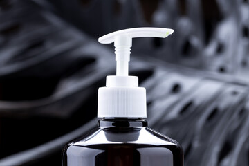 soap dispenser product bottle over dark luxury background. copy space. hygiene washing lifestyles conceptual