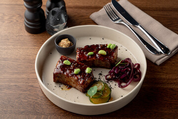 Tofu steak, marinated in teriyaki sauce and served with edamame beans, gourmet meal in a fancy restaurant, top view