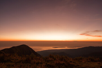 Beautiful view sunrise and foggy landscape from top of mountain in the morning at Rinjani National Park, Lombok, Indonesia