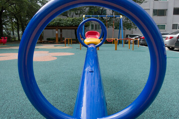 Modern colorful children playground in public park.