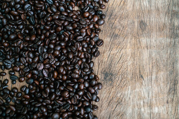 Coffee beans on old rusty brown wood background