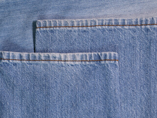 jeans pants texture abstract background a rough indigo blue febric surface vintage western fashion style by closeup detail of denim