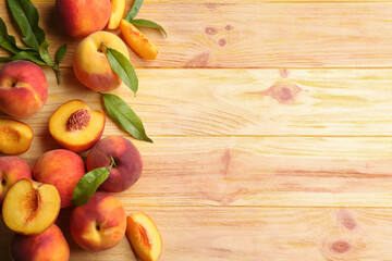 Naklejka na ściany i meble Fresh sweet peaches on wooden table, flat lay. Space for text