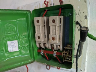 Old electric main switch of a village home