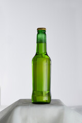 Green beer bottle just taken out of the fridge