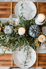 Autumn table setting with pumpkins.