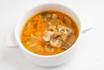 vegan soup with mushrooms on white background