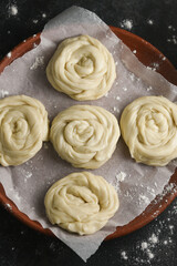 Making preparing of dough Indian flatbread bakery products. Maida or wheat flour Cooking the dough.  Kerala paratha porotta roti Malabar parotta barotta is Indian layered flatbread, street food snack