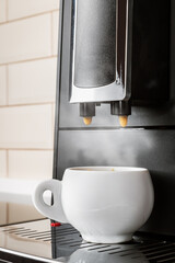 ceramic Cup of coffee Prepared on the coffee machine