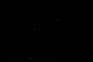 Obraz na płótnie Canvas Stars on a dark night sky. Blurred, defocus. Abstract background