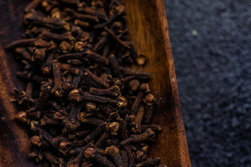 Cloves spices on stone background