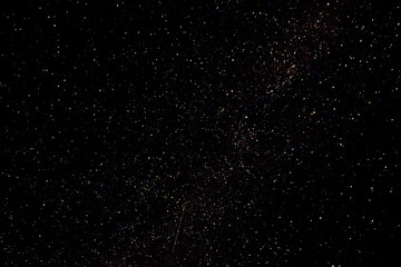 Stars on a dark night sky. Blurred, defocus. Abstract background