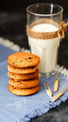 Fresh oatmeal cookies on a dark background
