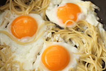 Pasta with egg in the pan