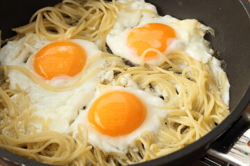 Pasta with egg in the pan