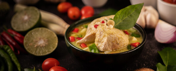 Green curry made with chicken, chili, and basil, with tomato, lime, kaffir lime leaves and garlic.