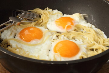 Pasta with egg in the pan