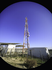Antenna mast photographed on wide angle lens
